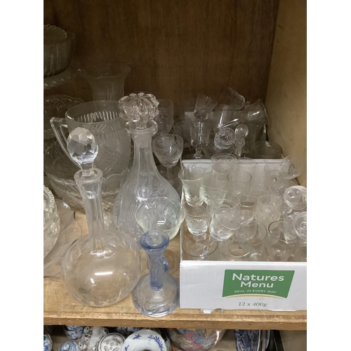 111 - A large quantity of moulded, cut, etched glassware including comports, bowls, decanters, vases, powd... 