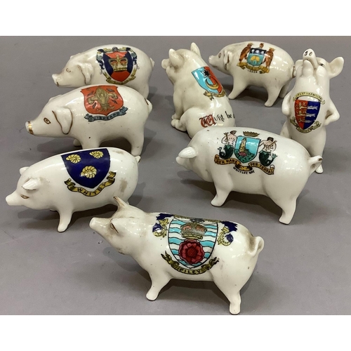 206 - A collection of eight crested china pigs, including Carlton ware, Willow art, Arcadian and other mak... 