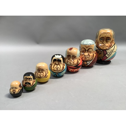 21 - A Russian doll set of seven each painted with a different Russian leader