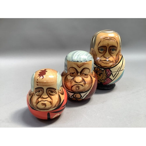 21 - A Russian doll set of seven each painted with a different Russian leader