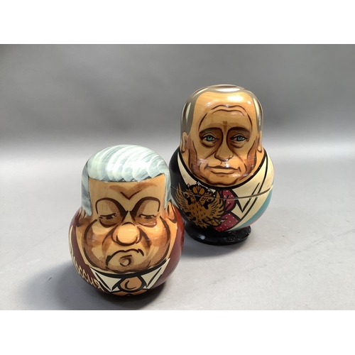 21 - A Russian doll set of seven each painted with a different Russian leader