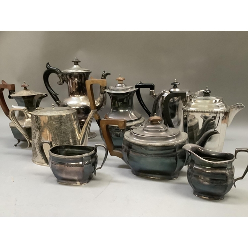 239 - A quantity of silver plated ware including four piece tea and coffee set, hot water jugs, teapot and... 