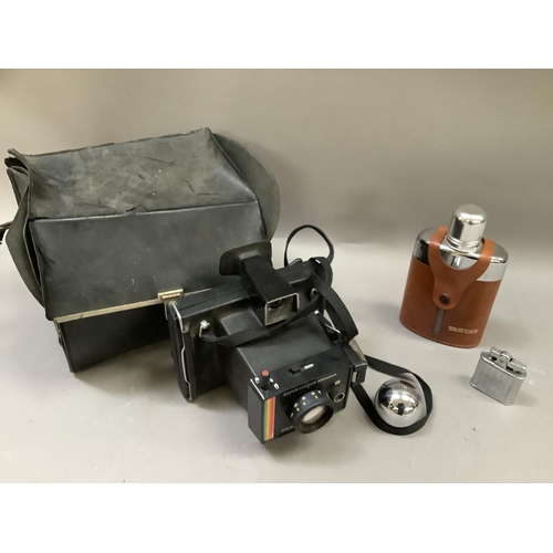 245 - A polaroid land camera 'Super Colour Swinger' in original case together with a spirit flask and ligh... 