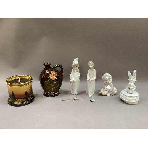 251 - Lladro figures, Inuit girl with polar bear cub , girl with candle and girl with basket, a Doulton Mi... 