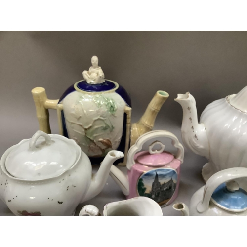 262 - A collection of Victorian and later teapots