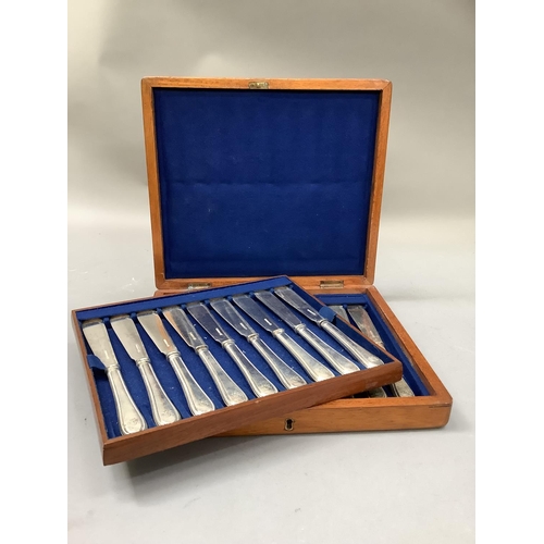 287 - A late Victorian mahogany canteen containing a set of eighteen silver plated fish knives with beaded... 