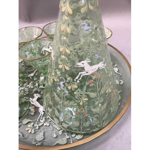 288 - An Art Deco liqueur set of pale green glass, enamelled with running antelope amongst scrolling leafa... 