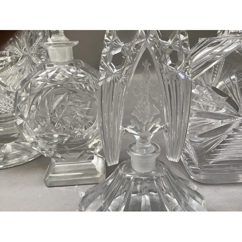 290 - A cut glass flower vase, a wedge shaped decanter  and two Lalique style perfume bottles