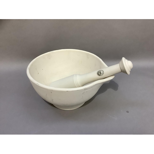 31 - A Mason Cash vitrified ceramic mortar and pestle, 32cm diameter x 18.5cm high