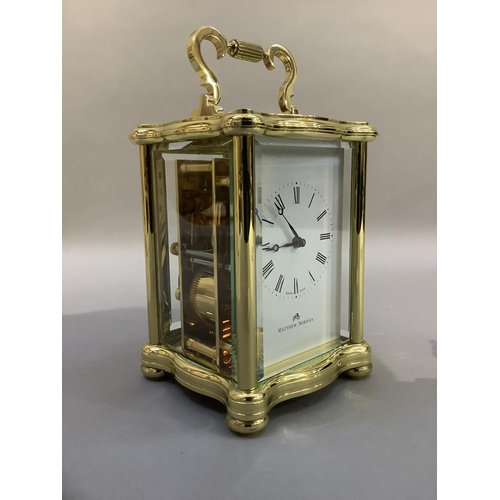 41 - A hand polished brass carriage clock by Matthew Norman having a white enamel dial with Roman numeral... 