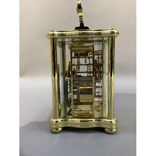 41 - A hand polished brass carriage clock by Matthew Norman having a white enamel dial with Roman numeral... 