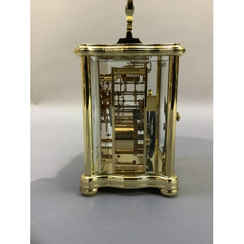 41 - A hand polished brass carriage clock by Matthew Norman having a white enamel dial with Roman numeral... 