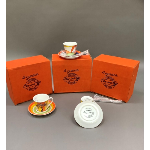 45 - Three reproduction Clarice Cliff cups and saucers Cafe Noir range in Windbells, Coral Firs and Fanta... 