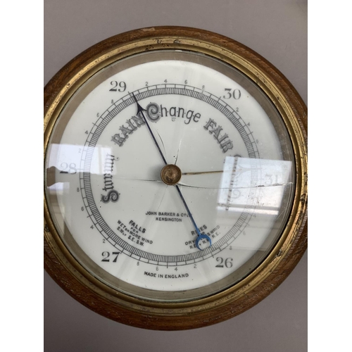 71 - An aneroid barometer by John Barker & Co Ltd, Kensington, brass cased and oak mount (glass cracked),... 