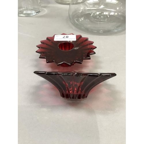 87 - A pair of Baccarat France ruby glass candle holders in the form of stylised flowerheads, signed, 9.5... 