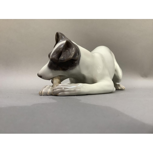 103 - A Royal Copenhagen figure of a terrier with bone, printed and painted marks to underside
9cm high x ... 