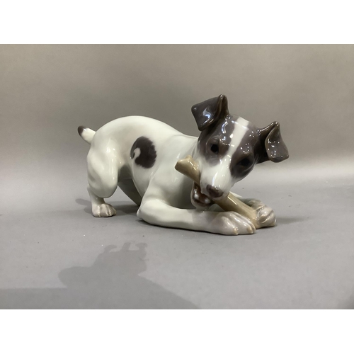 103 - A Royal Copenhagen figure of a terrier with bone, printed and painted marks to underside
9cm high x ... 