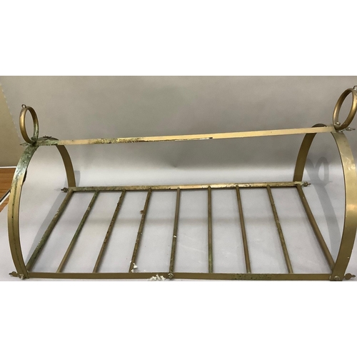 147 - A brass hanging rack of D section with circular pendant loops