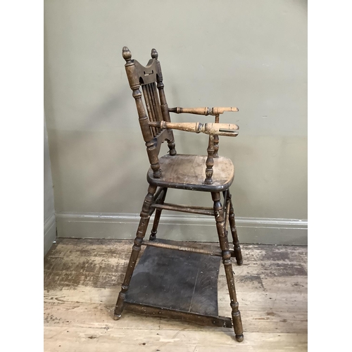 164 - An early 20th century child's high chair with rail back and turned framing, converting to a play cha... 