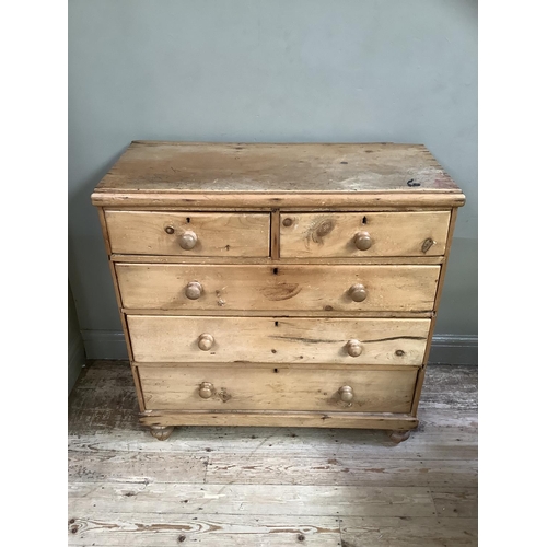 193 - A Victorian pine chest of two short and three long drawers on turned feet