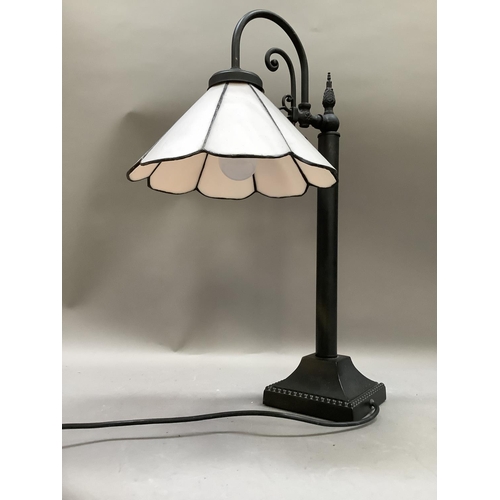 285 - A pale pink and black metal table lamp  with arched arm, 48.5cm high