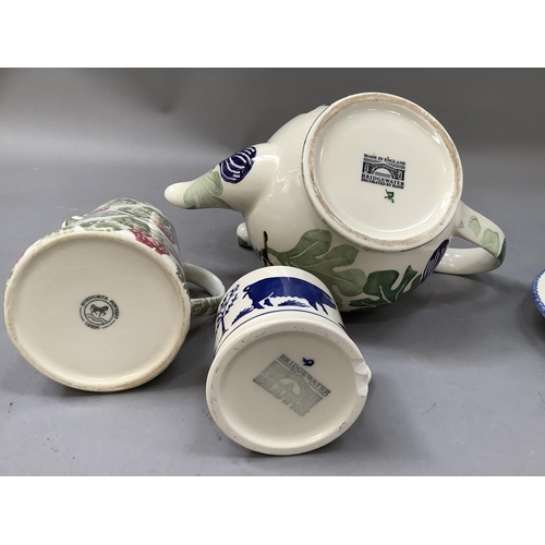 301 - A Bridgewater hand painted teapot of leaf design together with a Betty's mug and a pig decorated  mu... 