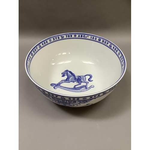 33 - A large Spode blue and white bowl from the Edwardian Childhood range, printed with rocking horse, dr... 