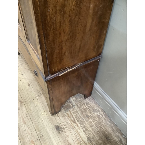 404 - An Edwardian oak  single mirror door wardrobe, drawer below, 100cm wide