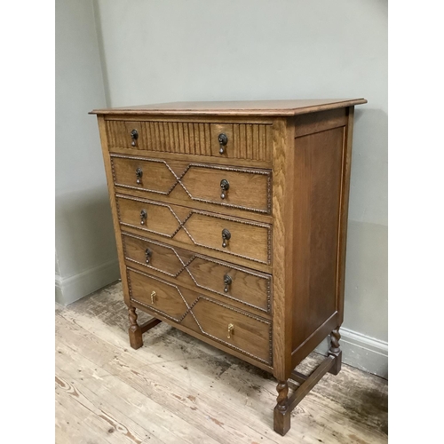 408 - A gentleman's 1930s oak dressing chest, the top drawer with strut mirror and various compartments la... 