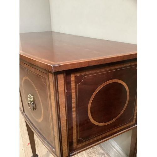 417 - An Edwardian mahogany and satinwood banded bow front sideboard, crossbanded and with line inlay havi... 