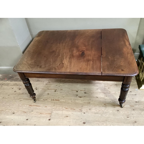 443 - A Victorian mahogany dining table, rectangular with rounded corners, on inverted tulip and turned le... 