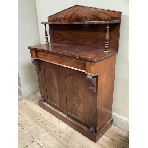 446 - A Victorian mahogany chiffonier having a raised arched back with shelf and turned uprights frieze dr... 