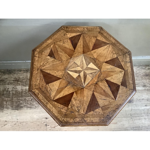 458 - A Victorian oak octagonal pedestal table inlaid with various woods in a geometric design within cros... 