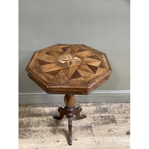 458 - A Victorian oak octagonal pedestal table inlaid with various woods in a geometric design within cros... 