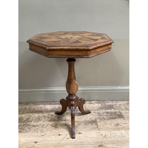 458 - A Victorian oak octagonal pedestal table inlaid with various woods in a geometric design within cros... 