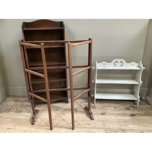 148 - A set of early 20th century oak bookshelves, 46cm wide together with a set of white painted wall she... 