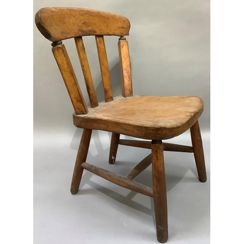 154 - A child's early 20th century rail back kitchen chair on turned framing together with a polished beec... 