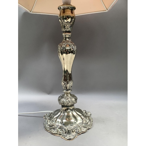 395 - A silver plated table lamp of baluster column and spreading base, 45cm to fitting