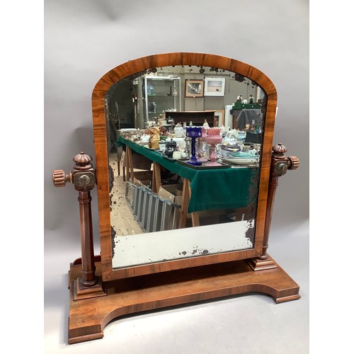 464 - A Victorian walnut dressing table mirror, arched outline on ring turned uprights with lobed finials,... 