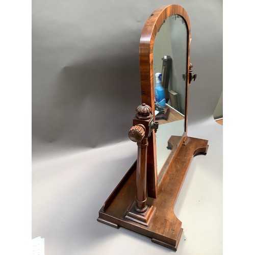 464 - A Victorian walnut dressing table mirror, arched outline on ring turned uprights with lobed finials,... 