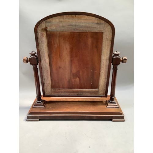 464 - A Victorian walnut dressing table mirror, arched outline on ring turned uprights with lobed finials,... 