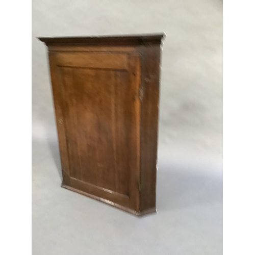 321 - A 19th century oak hanging corner cupboard