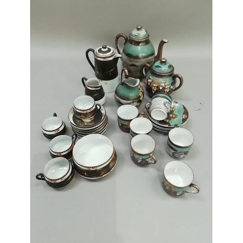 39 - A Japanese coffee set painted with deities and attendants, comprising coffee pot, milk jug, lidded s... 