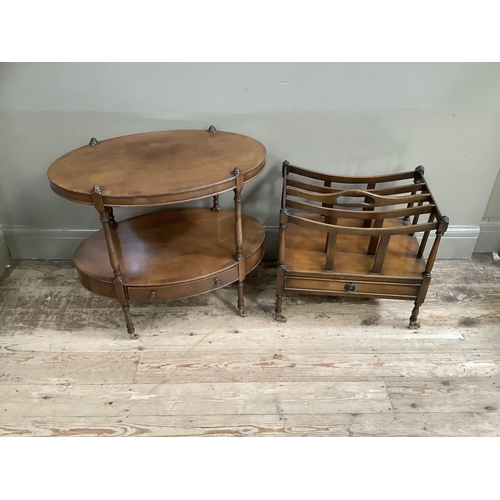 67 - An oval mahogany two tier table, the under tier fitted with a drawer, on slender turned legs with br... 