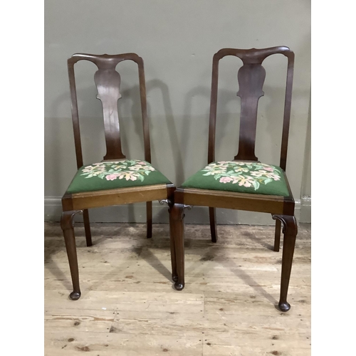 72 - A pair of mahogany single chairs having a vase splat, floral needlework sear and on cabriole legs wi... 