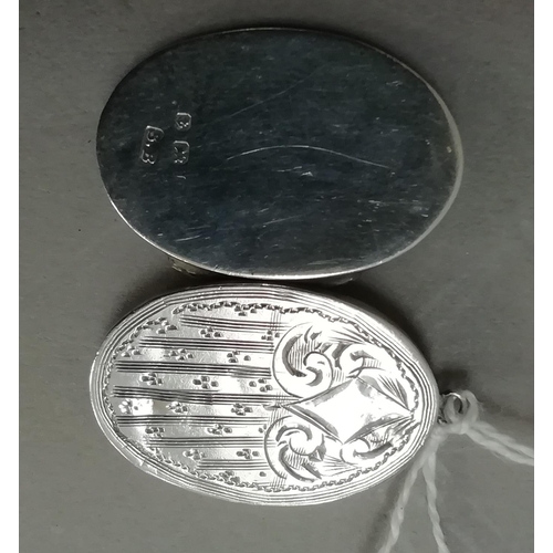 254 - A George V oval silver locket, foliate scroll engraved to the front with open cartouche, Birmingham ... 