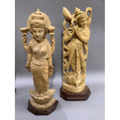 10 - Four Indian carved balsa wood figures of Shiva and three other Indian deities, measuring approximate... 