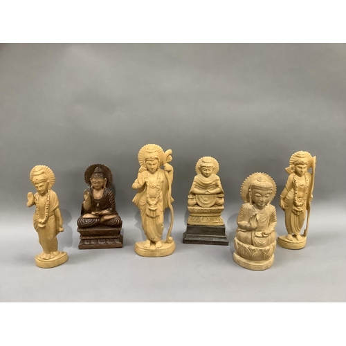 12 - Six Indian carved balsa wood figures of Buddha and other Indian deities measuring 20cm down to 16cm