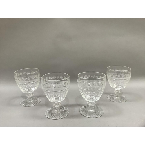 23 - A set of four 19th century wine goblets, the panel cut bodies having a border, fan cut and octagonal... 