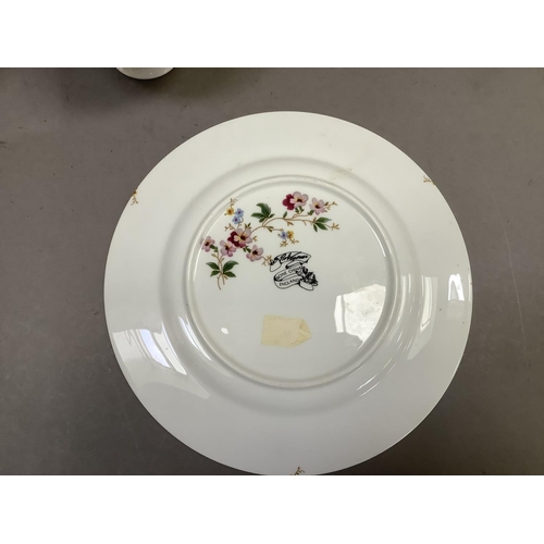 26 - A china part service printed in pink, blue, mauve and green with a ribbon and floral sprays design c... 